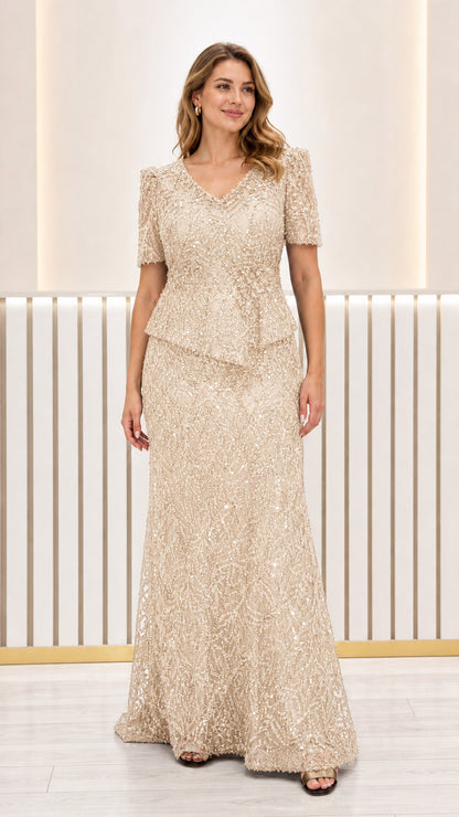 Front view of champagne gold sequined peplum formal maxi dress