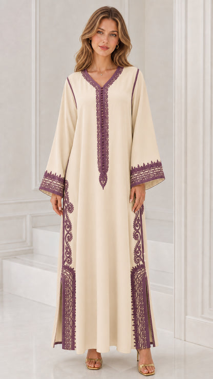 Front full view of woman wearing cream off-white kaftan dress with purple embroidery