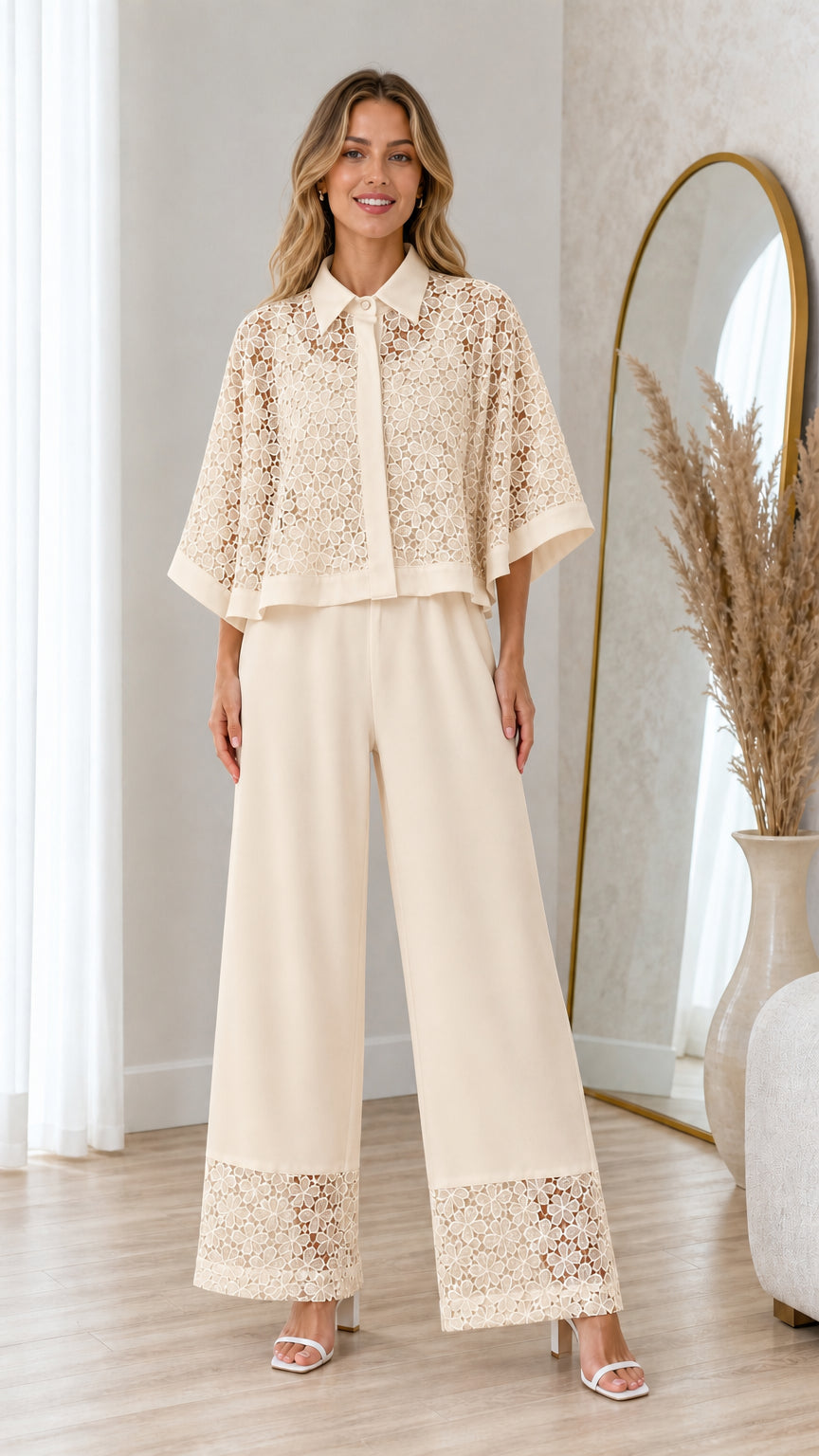 Model wearing champagne cream floral lace cape blouse and wide-leg trousers