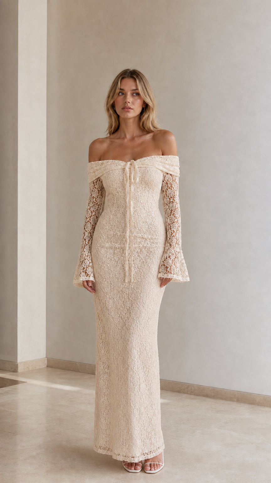 Woman wearing champagne cream off-the-shoulder lace maxi dress