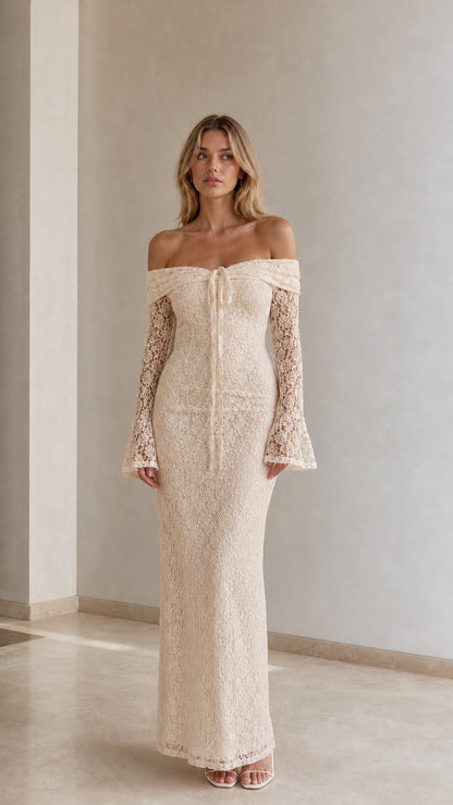 Woman wearing champagne cream off-the-shoulder lace maxi dress