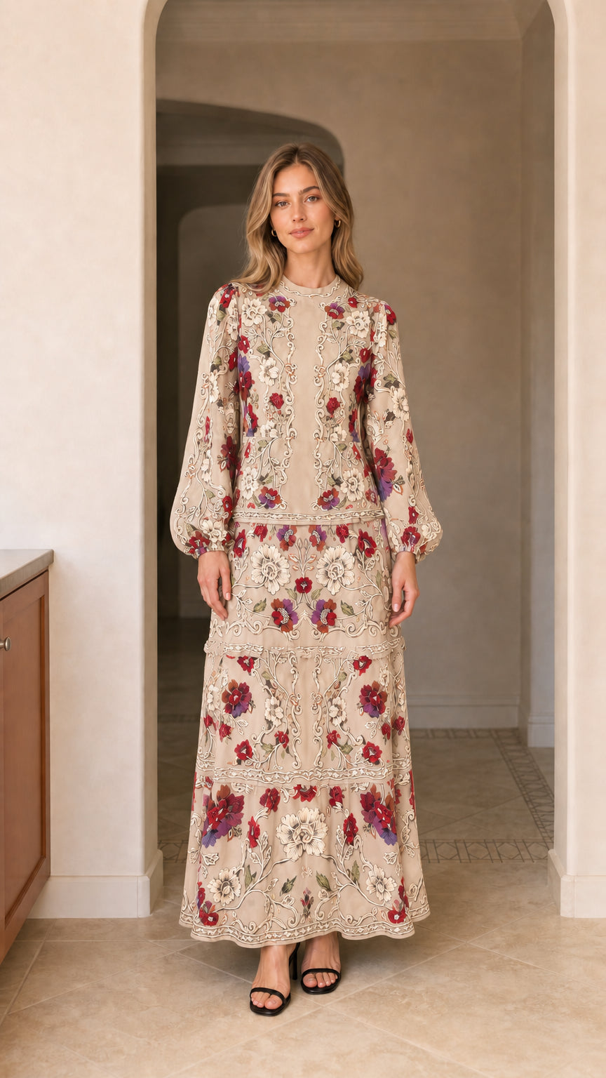 Model wearing long sleeve tiered floral maxi dress in beige cream
