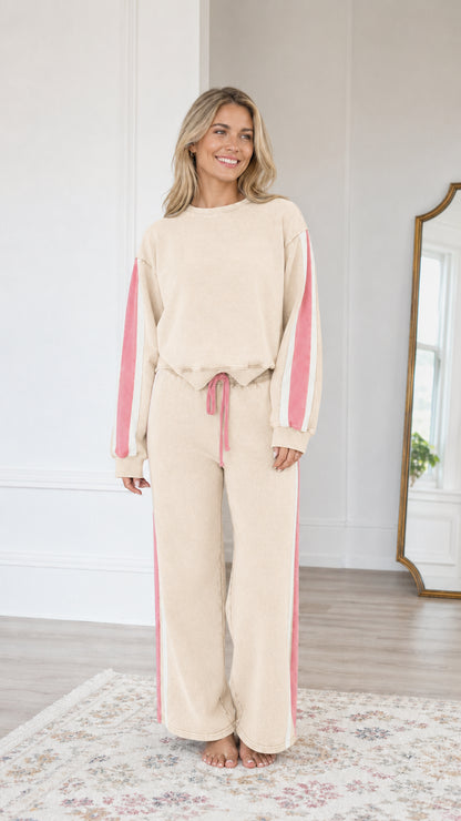 Front view of model wearing the Cream beige vintage washed sweatshirt and wide-leg sweatpants set