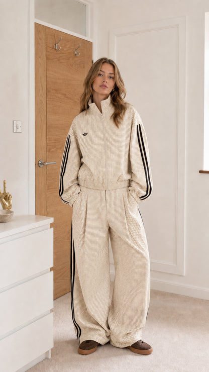 Cream gingham women's track stripe jumpsuit shown from the front
