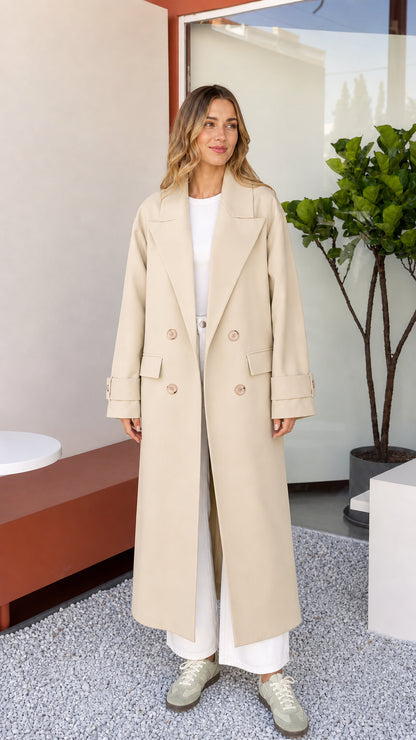Front view of woman wearing neutral Beige longline tailored coat