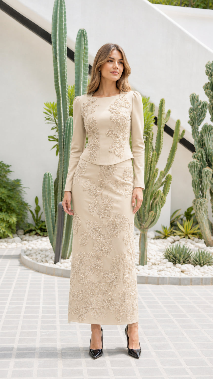 Front view of champagne beige embroidered long-sleeve maxi evening skirt set