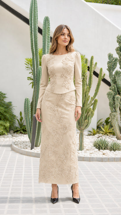 Front view of champagne beige embroidered long-sleeve maxi evening skirt set