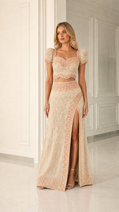 Model wearing champagne gold beaded two-piece formal evening dress set