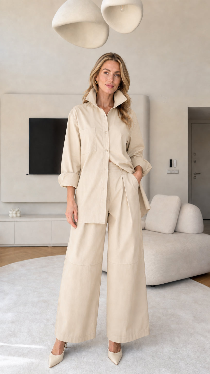 Front view of women's matching button-down shirt and wide-leg trousers set in Beige
