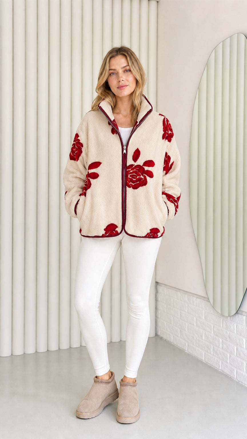 Model wearing beige fleece jacket with red floral pattern