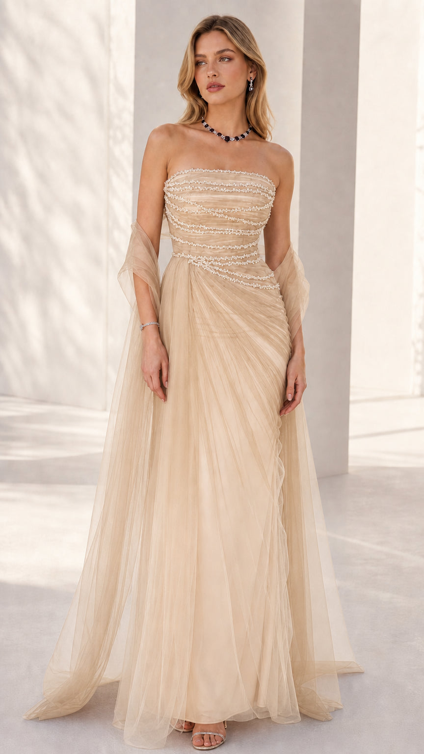Front view of the strapless beaded formal evening gown in champagne gold tulle