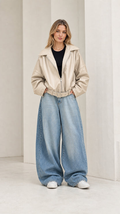 Full front view of model wearing cream beige oversized faux leather jacket