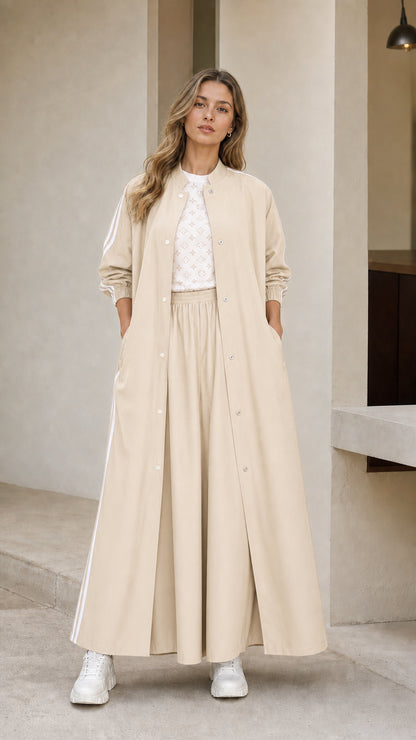 Woman wearing beige cream sporty maxi duster jacket and wide leg pants set
