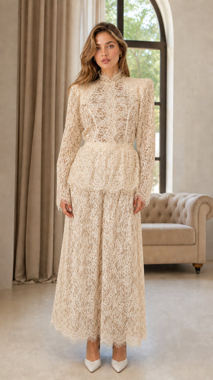 Front full view of woman wearing champagne cream floral lace wide leg jumpsuit