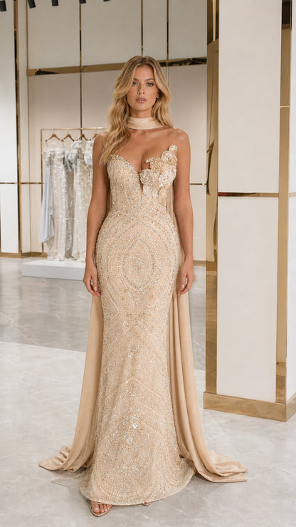 Champagne gold embellished strapless evening gown with elegant floor-length cape