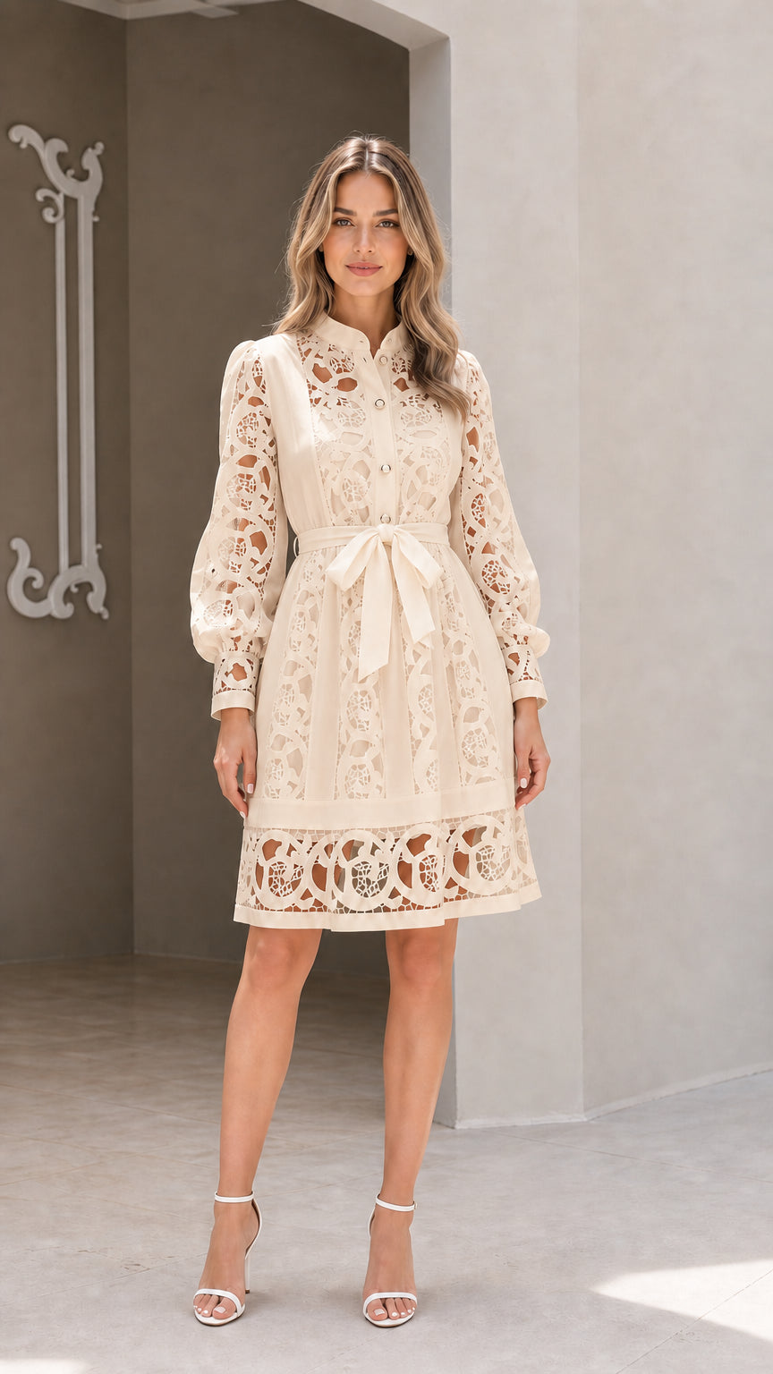 Model wearing champagne beige long sleeve embroidered lace belted shirt dress