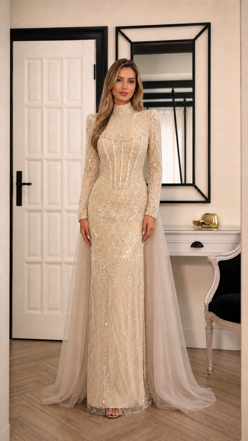 Model wearing champagne gold beaded long sleeve formal gown with sweep train