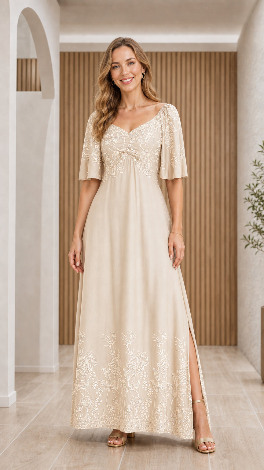 Front view of woman wearing Beige champagne floral embroidered maxi dress