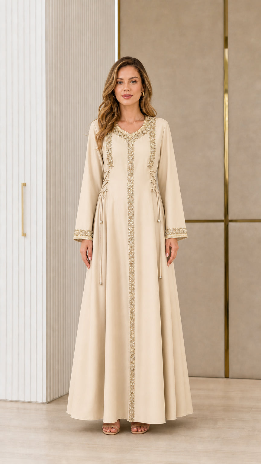 Model wearing champagne cream embroidered kaftan maxi dress