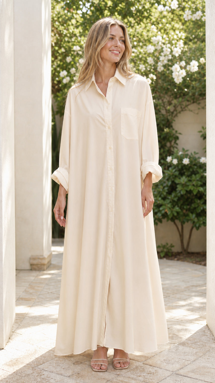 Woman wearing cream beige relaxed fit long sleeve maxi shirt dress